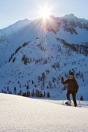 Bivera mountain at sunset. Trekking with snowshoes near Casera Razzo, Sauris