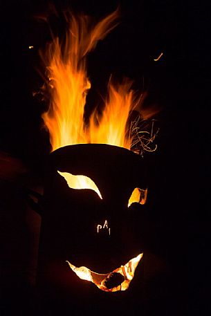 Mask on fire the traditional carnival celebration of Sauris