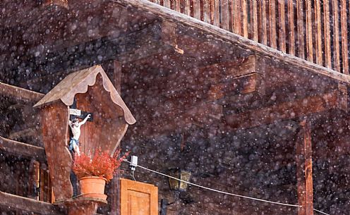 Alpine village of Sauris under a heavy snowfall: wood typical houses. Sauris Alpine village of Sauris under a heavy snowfall: wood typical houses. Sauris