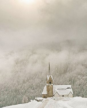 San Lorenzo church in Sauris di Sopra during a heavy snowfall