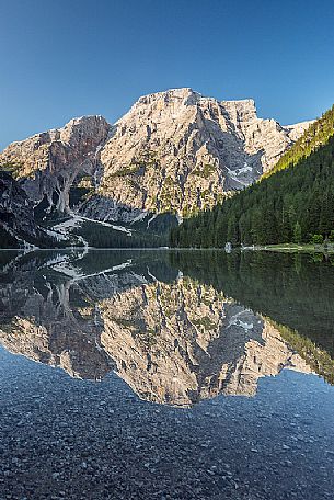 Braies Lake (Pragser Wildsee) with first light morning on Croda del Becco mountain (Seekofel), Dolomites, South Tyrol, Italy 