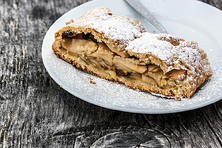 Strudel, typical sweet cake of Dolomites, South Tyrol, Dolomites, Italy