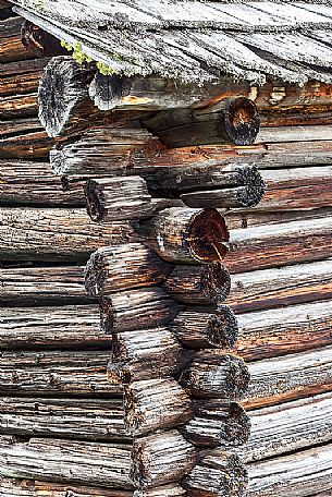 Closeup of corner of a typical wooden building in a alpine village, Badia Valley, dolomites, Italy