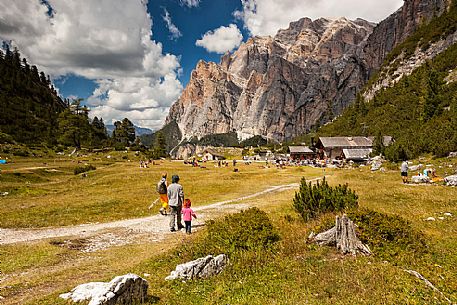 Tourists walking along the path of Scotoni hut, Badia Valley,South Tyrol, Dolomites, Italy 