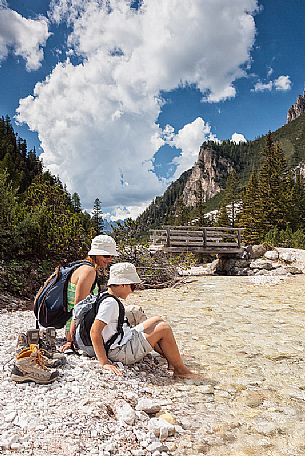 Enjoying with water of a stream, Badia Valley, South Tyrol, Dolomites, Italy 