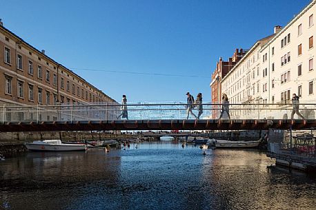 People over the bridge of Canal grande in Trieste city center, Italy, Europe