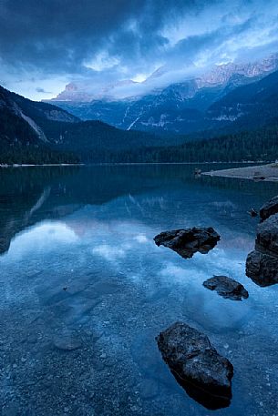 Tovel lake and the Brenta's dolomites at dusk, Val di Non, Trentino, Italy Tovel lake and the Brenta's dolomites at dusk, Val di Non, Trentino, Italy