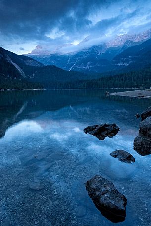 Tovel lake and the Brenta's dolomites at dusk, Val di Non, Trentino, Italy