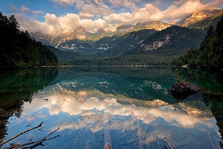 Sunrise at Tovel lake and the Brenta's dolomites, Val di Non, Trentino, Italy