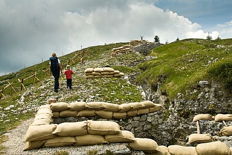 Walking among the trenches of the open-air museum of the Great War, Monte Zebio mountain, Asiago, Italy