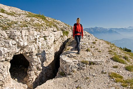 Hiker on the summit of Ortigara mount, Asiago, Italy