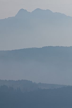 The Verena mount in the morning mist, Asiago plateau, Italy