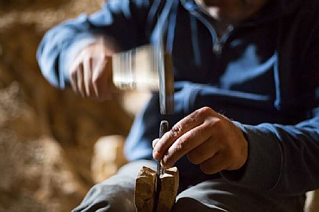 Massimo Cerato is working in the fossil bed of Pesciara in Bolca, Lessini mountain, Italy