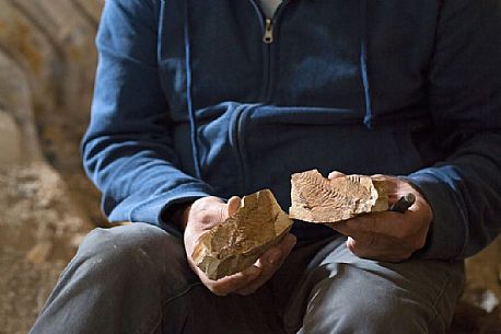 Massimo Cerato is working in the fossil bed of Pesciara in Bolca, Lessini mountain, Italy