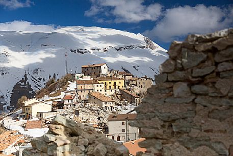 Castelluccio di Norcia, the old village destroyed by the earthquake of 2016, in the background the Vettore montain and its fault, Sibillini national park, Italy