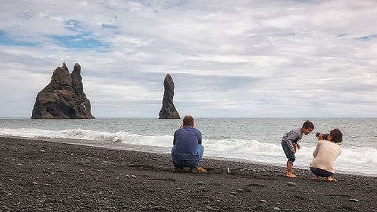 Family at Reynisdrangar Basalt Rocks on Cape Dyrholaey, Vik i Myrdal, Iceland