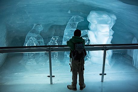 Child admiring the ice sculptures in the museum on the top of Jungfraujoch, the highest railway station in the Alps, Aletsch glacier, Bernese alps, Switzerland, Europe