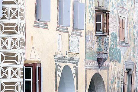 Detail of  old houses in Ardez. In the background Chasa Clalguna, historic house with frescos representing Adam and Eve, Low Engadin, Canton of Grisons, Switzerland, Europe
