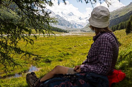 Relax in Roseg valley, in the background the glacier and the Piz Roseg in the Bernina mountain group, Pontresina, Engadine, Canton of Grisons, Switzerland, Europe