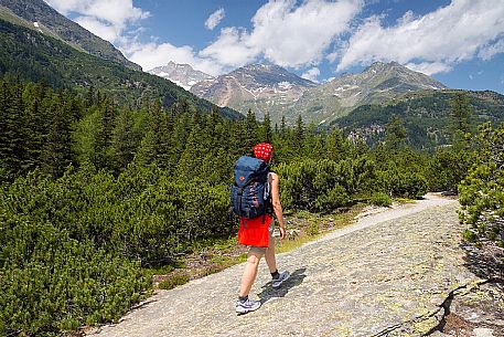 Hiker in the Cavaglia Glacial Garden  also referred to as Giants Pots, Cavaglia, Poschiavo valley, Engadin, Canton of Grisons, Switzerland, Europe