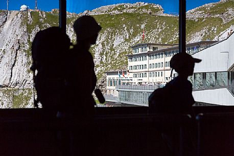 Tourists silhouette at the summit station of Pilatus Cogwheel Railway , Lucerne, Border Area between the Cantons of Lucerne, Nidwalden and Obwalden, Switzerland, Europe