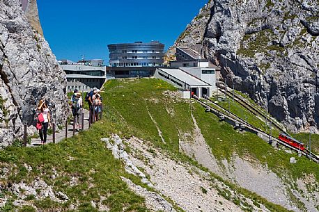 The red Cogwheel Railway arriving at the Pilatus Mountain station, Border Area between the Cantons of Lucerne, Nidwalden and Obwalden, Switzerland, Europe