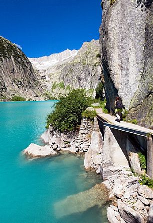 Hiking at the Gelmer lake, Gelmersee, a hydroelectric reservoir, Canton of Berne, Switzerland, Europe