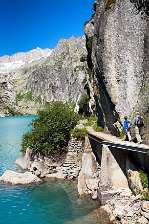 Hiking at the Gelmer lake, Gelmersee, a hydroelectric reservoir, Canton of Berne, Switzerland, Europe