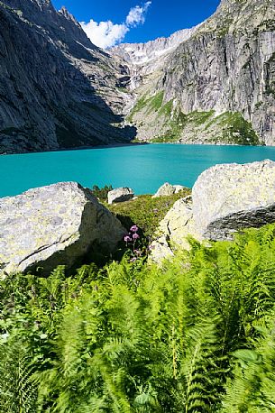 Stacked stones in the shore of Gelmer lake, Gelmersee, a hydroelectric reservoir, Canton of Berne, Switzerland, Europe