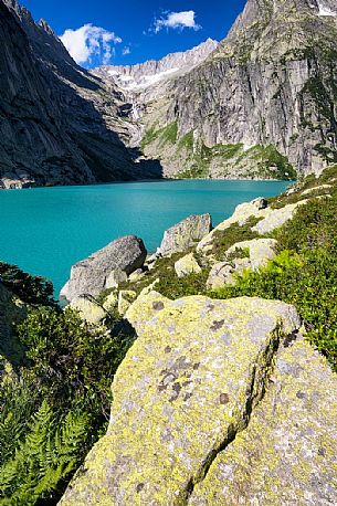 Stacked stones in the shore of Gelmer lake, Gelmersee, a hydroelectric reservoir, Canton of Berne, Switzerland, Europe