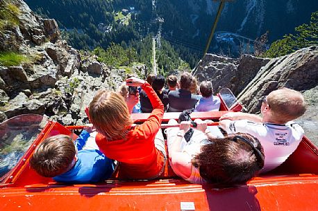 Tourist photographs the steep descent from the Gelmer funicular, the steepest in the world, Canton of Bern, Switzerland, Europe
