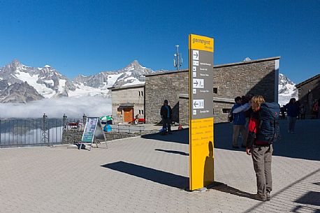 Tourist at the Gornergrat summit railway station, Zermatt, Valais, Switzerland, Europe