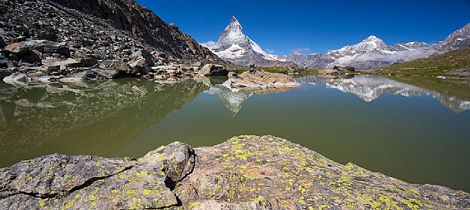 The Matterhorn or Cervino mount reflected in the Riffelsee Lake (Riffel lake), Gornergrat, Zermatt, Valais, Switzerland, Europe
 