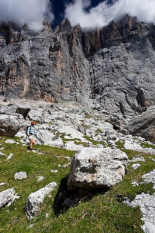 Hiker in the Marmolada mountain range, Ombretta valley, dolomites, Veneto, Italy, Europe