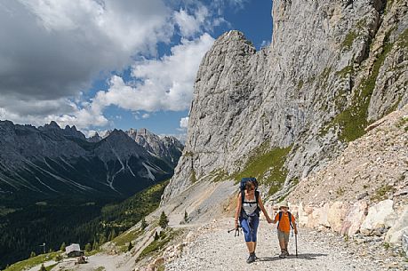 Mother and child walking in Sesis valley, Sappada, dolomites, Friuli Venezia Giulia, Italy, Europe