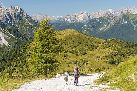 Mother and child near the source of the Piave river and in the background the dolomites of Cadore, Sappada, dolomites, Friuli Venezia Giulia, Italy, Europe