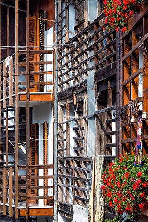 Detail of traditional house with the dalz, the typical wooden balcony in the small village of Andreis, Friuli Venezia Giulia, dolomites, Italy, Europe