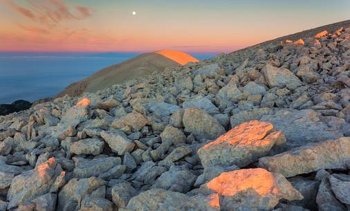 Moon and sunrise at the Mount Acquaviva in the amphitheater of the Murelle, Majella national park, Abruzzo, Italy, Europe