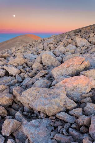 Moon and sunrise at the Mount Acquaviva in the amphitheater of the Murelle, Majella national park, Abruzzo, Italy, Europe