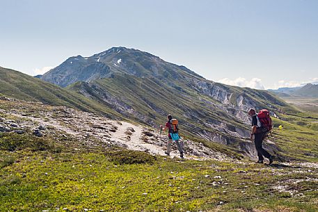 Hikers in the path to Camicia mount, Gran Sasso national park, Abruzzo, Italy, Europe