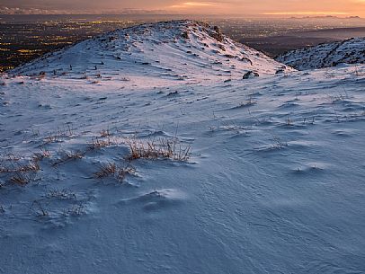 Twilight on the summit of Piccoc mount and in the backgroud the lighting towns of Veneto and Friuli Venezia Giulia, Cansiglilo, Veneto, Italy, Europe