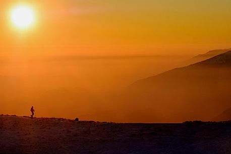 Hiking with snowshoe on the top of Pizzoc mount, Cansiglio plateau, Veneto, Italy, Europe