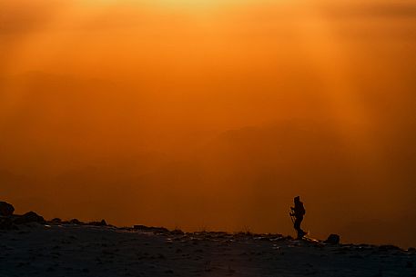 Hiking with snowshoe on the top of Pizzoc mount, Cansiglio plateau, Veneto, Italy, Europe