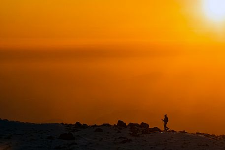 Hiking with snowshoe on the top of Pizzoc mount, Cansiglio plateau, Veneto, Italy, Europe