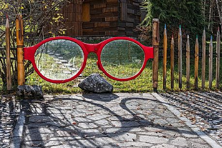 Unusual gate in Book house of Tambre, Cansiglio, Veneto, Italy, Europe