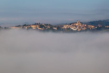 The small village of Grazzano Badoglio in the fog, Monferrato, Piedmont, Italy, Europe