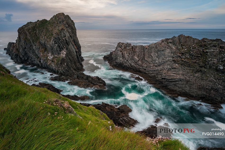 Malin head and its oblique rocks raising from the water, making their stand at the ocean's strength