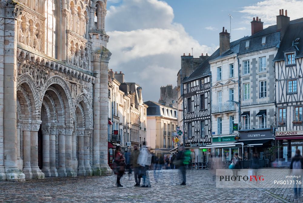 View of Notre-Dame-La-Grand, one of the most important Churches in Poitiers, with its beautiful romanesque facade on the left.