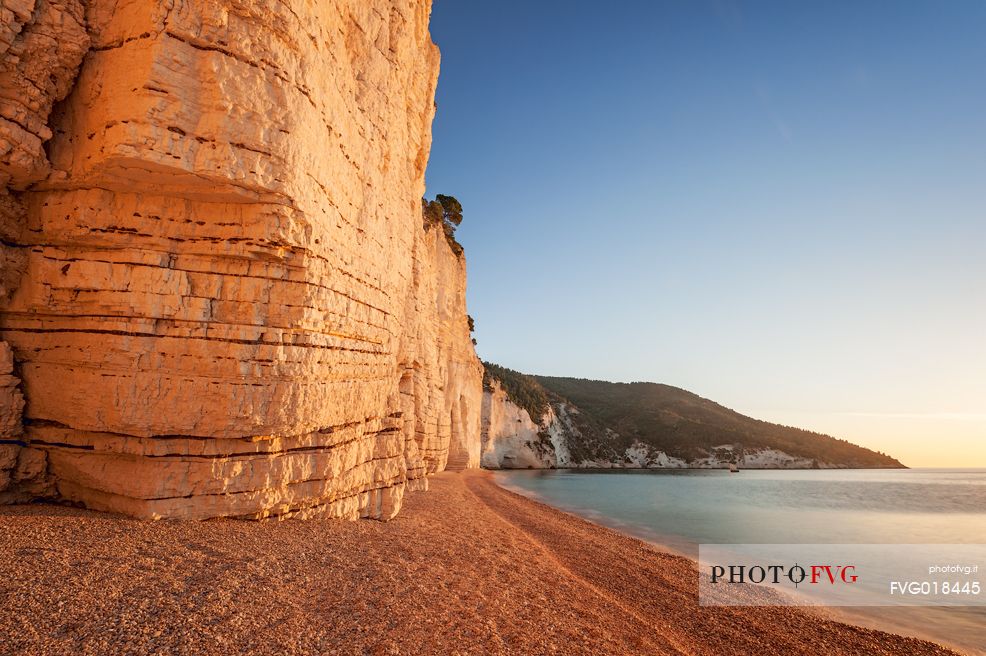 Vignanotica Beach is one of the most spectacular on the Gargano coast. The dawn lights up the white rocks making them just like gold, and giving golden moments of magic.