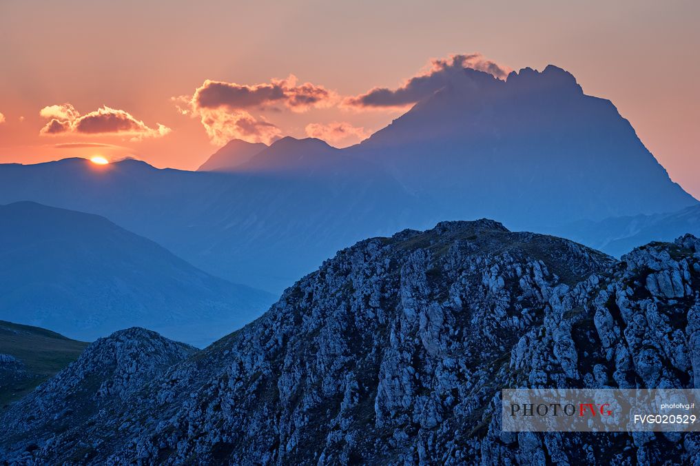 The Gran Sasso mountains and peaks seen from Mount Bolza's ridge after sunset